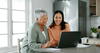 Older woman and younger woman looking at computer